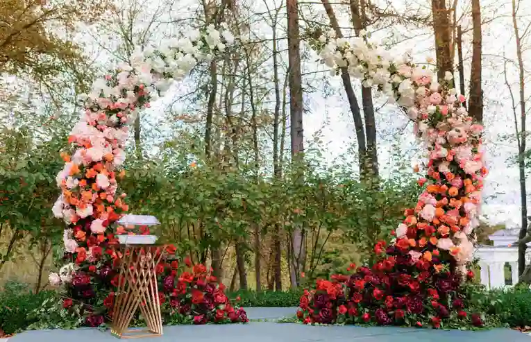 This image showcases a stunning floral arch, perfect for an eco-friendly wedding ceremony.