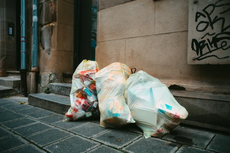 The image of trash bags showing the disposal of waste